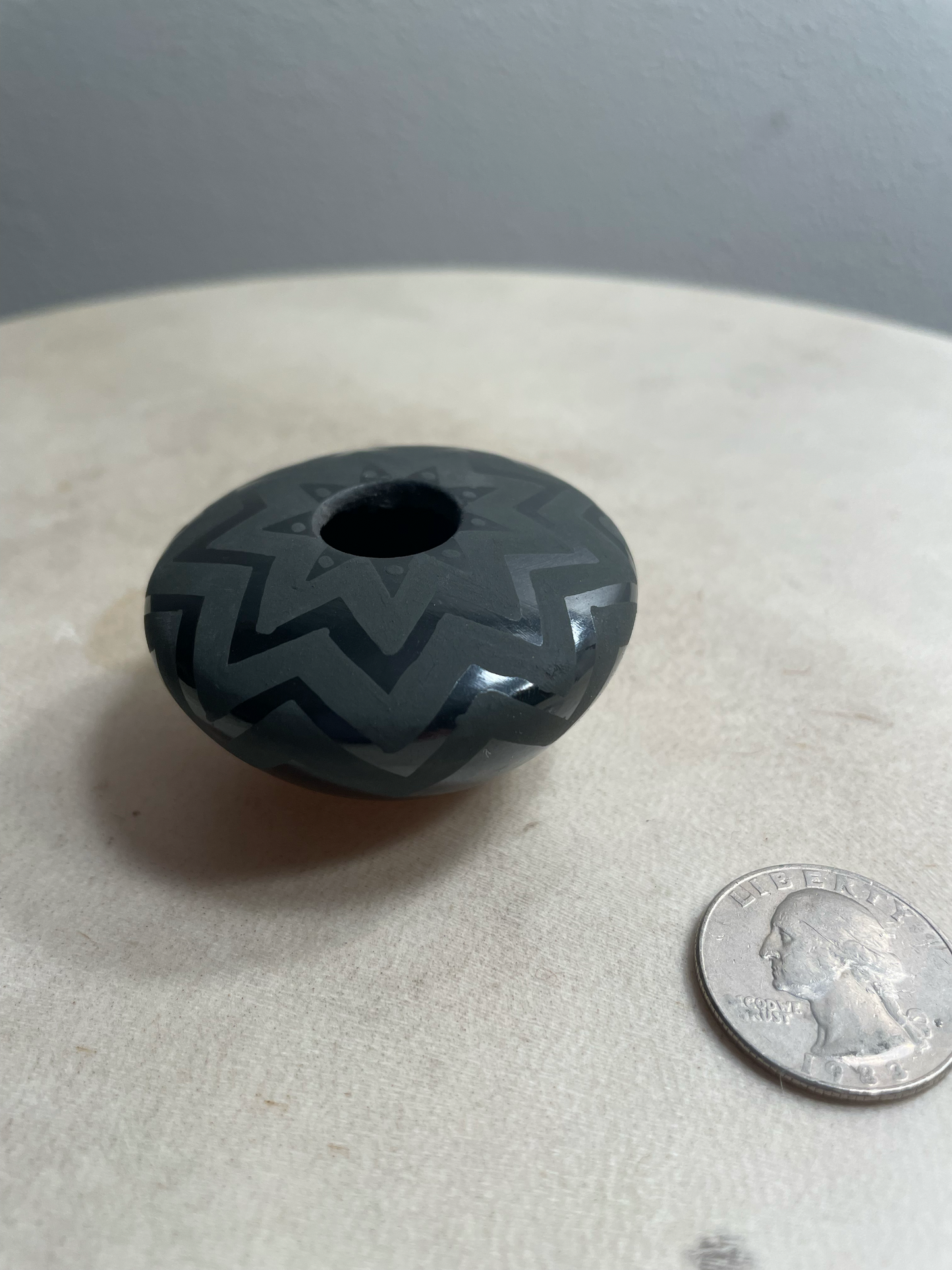 Black geometric Mata Ortiz concentric star pattern